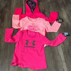 A bundle of 3 under Armour long sleeve shirts and sweatshirt.